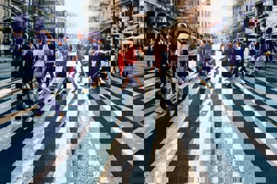 Group of people walking on pedestrian lane