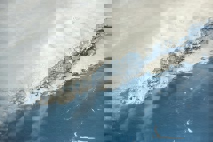 Snow covered mountain and ice shelf