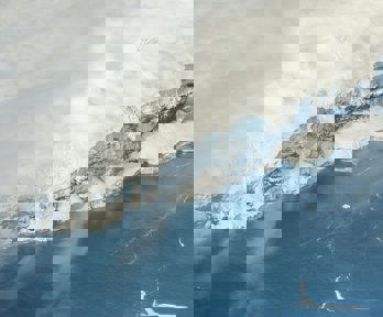 Snow covered mountain and ice shelf