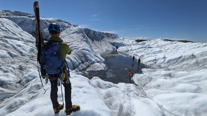 Expedition members hike across Isunnguata Sermia, a glacier of the Greenland Ice Sheet.