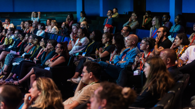 Delegates watching a lecture at the annual conference in 2024, in the Ondaatje Theatre