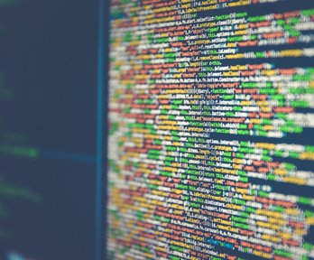 Computer screen with lines of code written across the screen