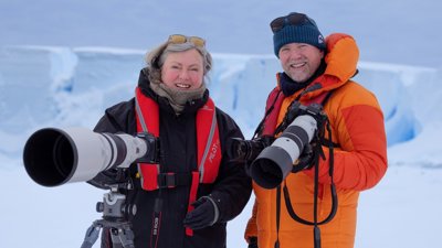 Photographers Sue Flood and Ian Dawson with cameras in Arctic.