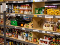 Store cupboard with food items displayed.