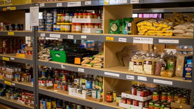 Store cupboard with food items displayed.
