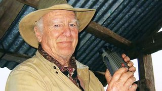 Peter Byrne holding binoculars