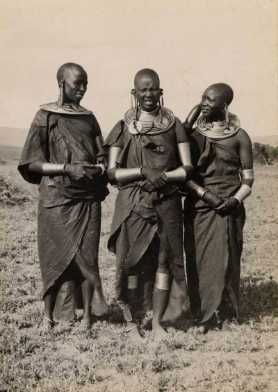 Three Kenyans dressed in tribal clothing