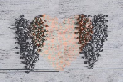 Coffee beans arranged in a heart shape