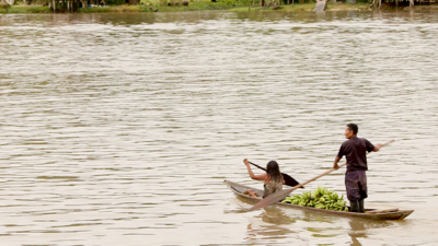 Two people in a boat on a river