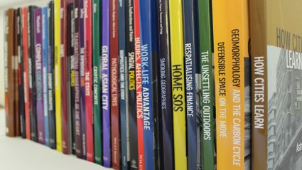 Shelf stacked with geographical journals 