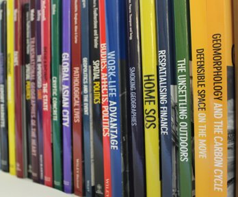 Shelf stacked with geographical journals
