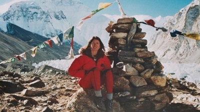 Rebecca Stephens sat on a rock, on Everest.