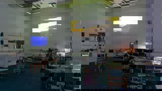 Person looking at the artist commission in Education Centre.