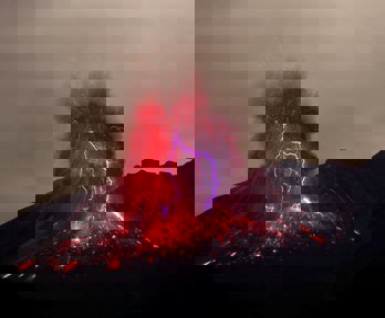 A volcano erupting, causing lightning to occur