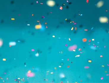 Confetti against blue background.