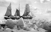 Historical black and white photograph of Endurance in full sail in the ice.