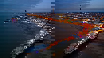 An aerial view over Blackpool beach at dusk