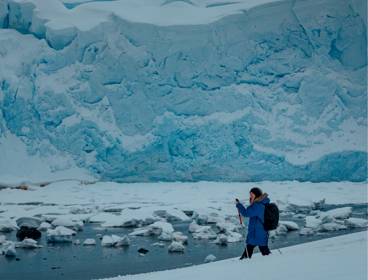 Phoebe Smith ice hiking on ice sheet.