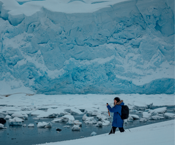 Phoebe Smith ice hiking on ice sheet.