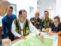 Society’s Director with representatives of the Penan communities, looking at Penan Community Maps