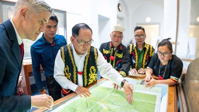 Society’s Director with representatives of the Penan communities, looking at Penan Community Maps