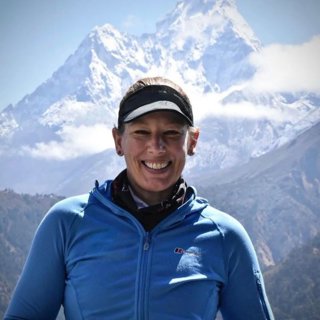 Jo Bradshaw stood in front of a mountain