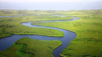 A lowland river meandering through grassland.
