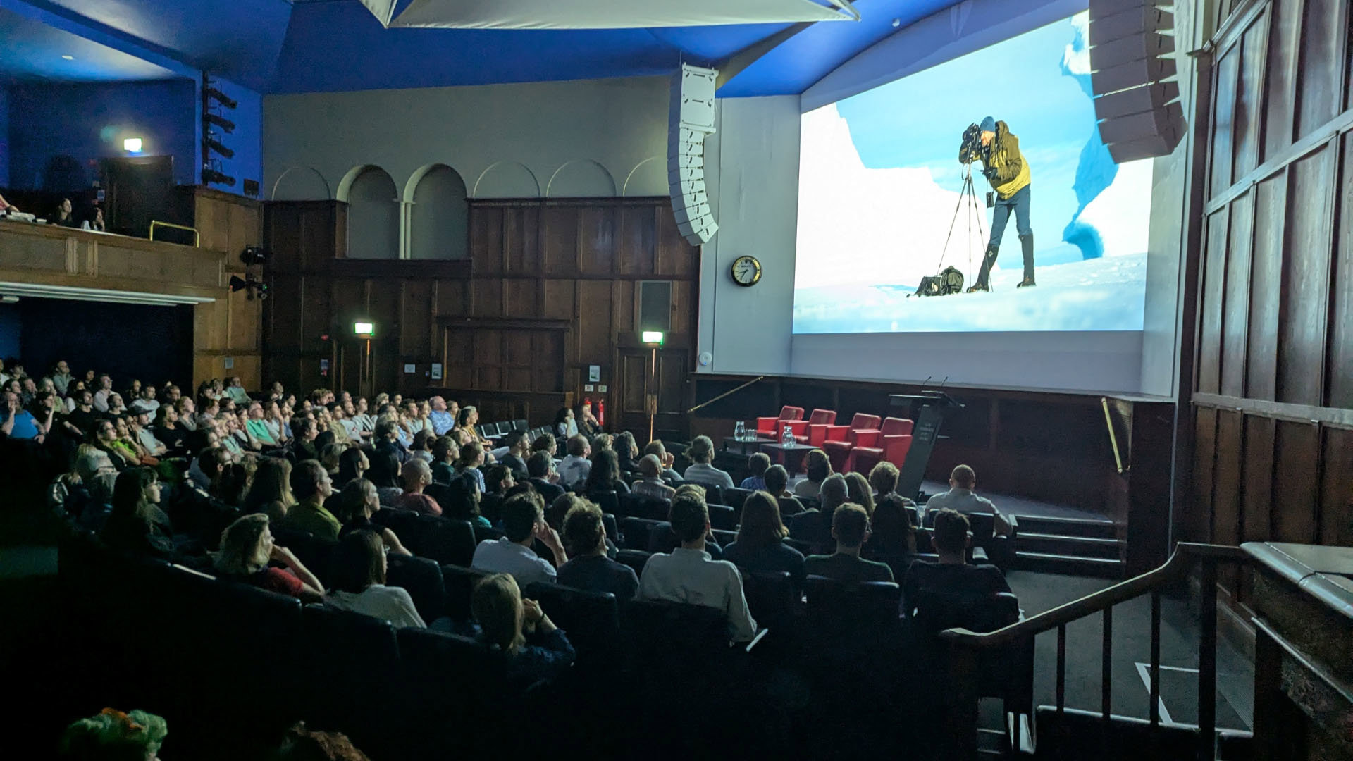Audience watching films in the Ondaatje Theatre at the summer film night.