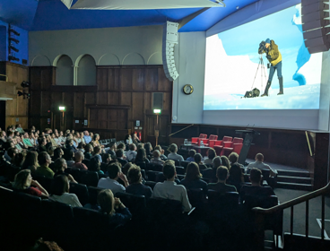 Audience watching films in the Ondaatje Theatre at the summer film night