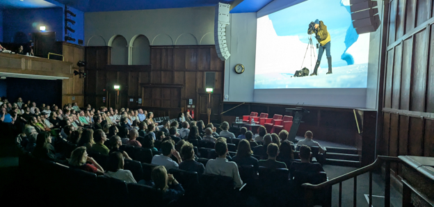 Audience watching films in the Ondaatje Theatre at the summer film night.