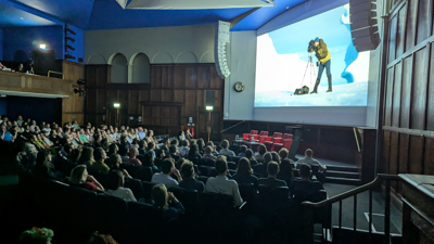 Audience watching films in the Ondaatje Theatre at the summer film night