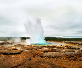 Geyser eruption with steam