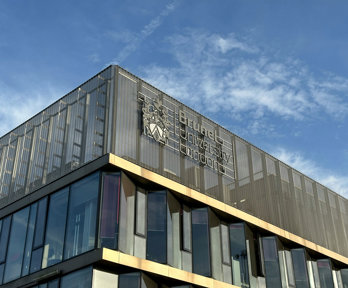 Brunel University of London buidling with blue sky background