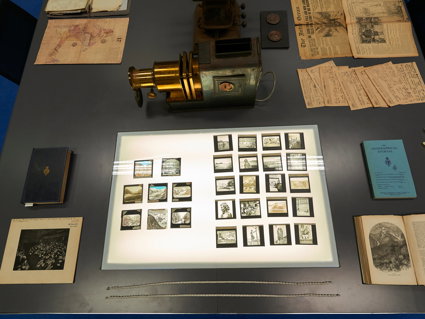 Display of historic materials, including photographs, lantern slides, and books