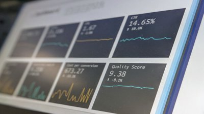 A data reporting dashboard on a laptop screen. Data is for illustrative purpose.