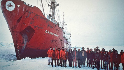 Crew from the Transglobe Expedition standing in the Arctic and posing with the Benjamin Bowring ship.