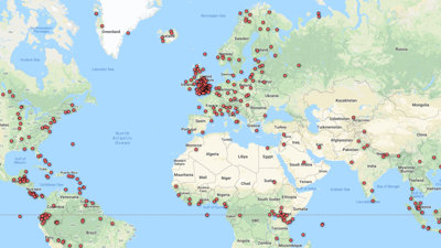 Red dots mark serveral location points on a digital world map.