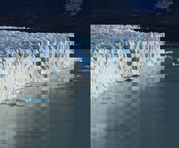 Ice cliff on body of water