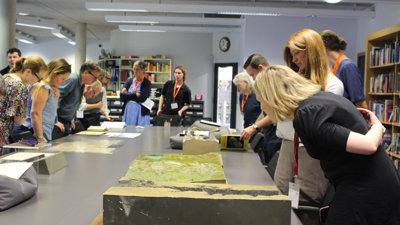 Delegates view the physical relief models in the Foyle Reading Room.