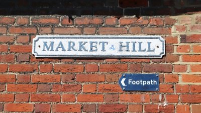 Plaque on a brick-wall titled 'Market Hill'.