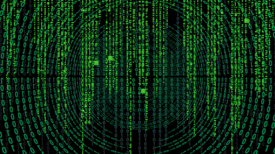 Zeros and ones as well as letters, both in green, fill a black background. the first layer creates a swirling pattern consiting of bones and zeros whilst the second layer, presented in the forground, are virtical lines of letters filling the screen but with only sme extending from top to bottom.