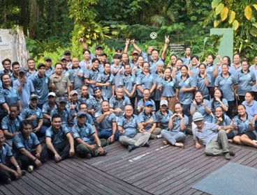 A large group of people in matching T-shirts in Mulu National Park.