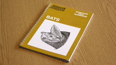 A copy of Expedition Field Techniques: Bat Surveys on a desk.