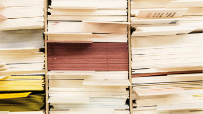 Stack of archive folders separated by labels seen from the side.