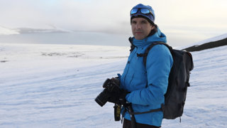 Enric in the snowy expanse of Franz Josef Land in Russia with camera equipment