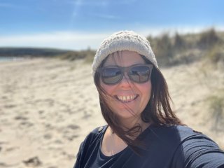 Jo Harris taking a selfie at the beach.