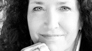 Black and white headshot of Marissa Roth.
