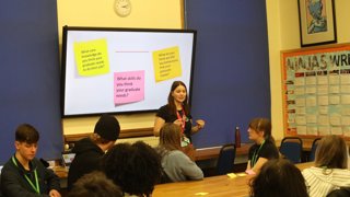 A presenter speaks about graduate skills to a group of students.