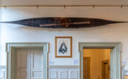 Kayak hangs on the wall in the Society