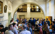 Explore delegates networking in the Main Hall at the Royal Geographical Society.